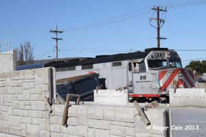 Our locally named locomotive (SSF 915) had an arm wrestling match with a tractor truck and trailer. It appears to be a draw, as neither one can move. As this is a southbound line this happened on, their routing the SB's onto the northbound track temporarily to get around.