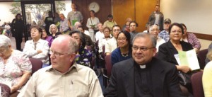 All Souls pastor Fr. Agnel De Heredia, right, and parish school principal Vincent Riener, left, attended a planning commission meeting May 2 to speak against a proposal by Planned Parenthood to open a clinic on the city’s main commercial stree