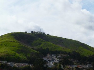 The north side of Sign Hill in it's annual wintery green is brown and barren this year.  Photo: Everything South City