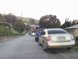 Designating a street one way does not solve the parking on sidewalk problem