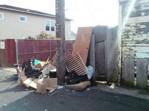 Garbage dumped in 85 year old Rudoni's carport must be dragged to the ally before City crews will clean up