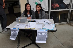 Ashley Shen and Alexis Vergara manning the admission table to the Open Mic for Anti-Bullying Week