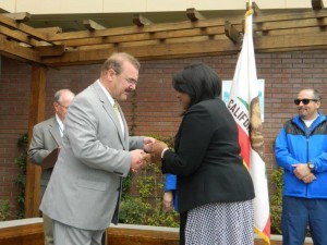 Patty Casey accepts a challenge coin in honor of her son who is stationed in Okinawa