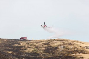 CalFire planes dropping over the mountain as firefighting crews worked the hoses