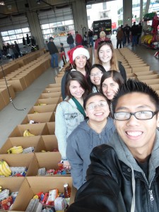 Young volunteers help pack holiday food boxes for the Louis P. Guaraldi Food Basket Program in December 2014 at SSF Fire Station 61. Photo Credit: Lisa DeMattei