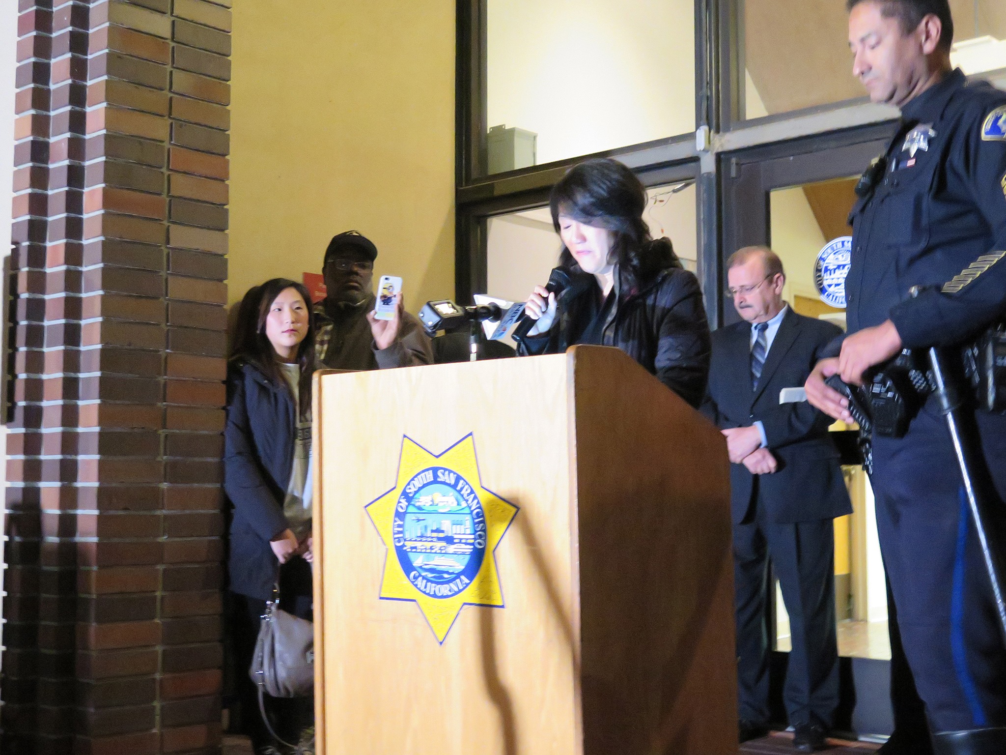 Yumi Chon, Officer Chon's sister, thanked the crowd for their support. "I beg you to please, please continue to pray for his recovery" Photo: SSFPD