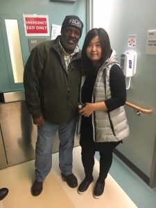 Stanley Roberts with Officer Chon's wife at the hospital 