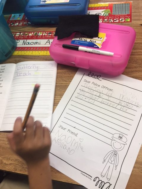 1st Grade letter and Ms. Arce's room pic = 1st graders in action writing their letters to Officer Chon, they are also using their dictionaries where they add academic words that they learn throughout the year as a resourcePhoto: Jonathan Covacha, Principal Martin Elementary School