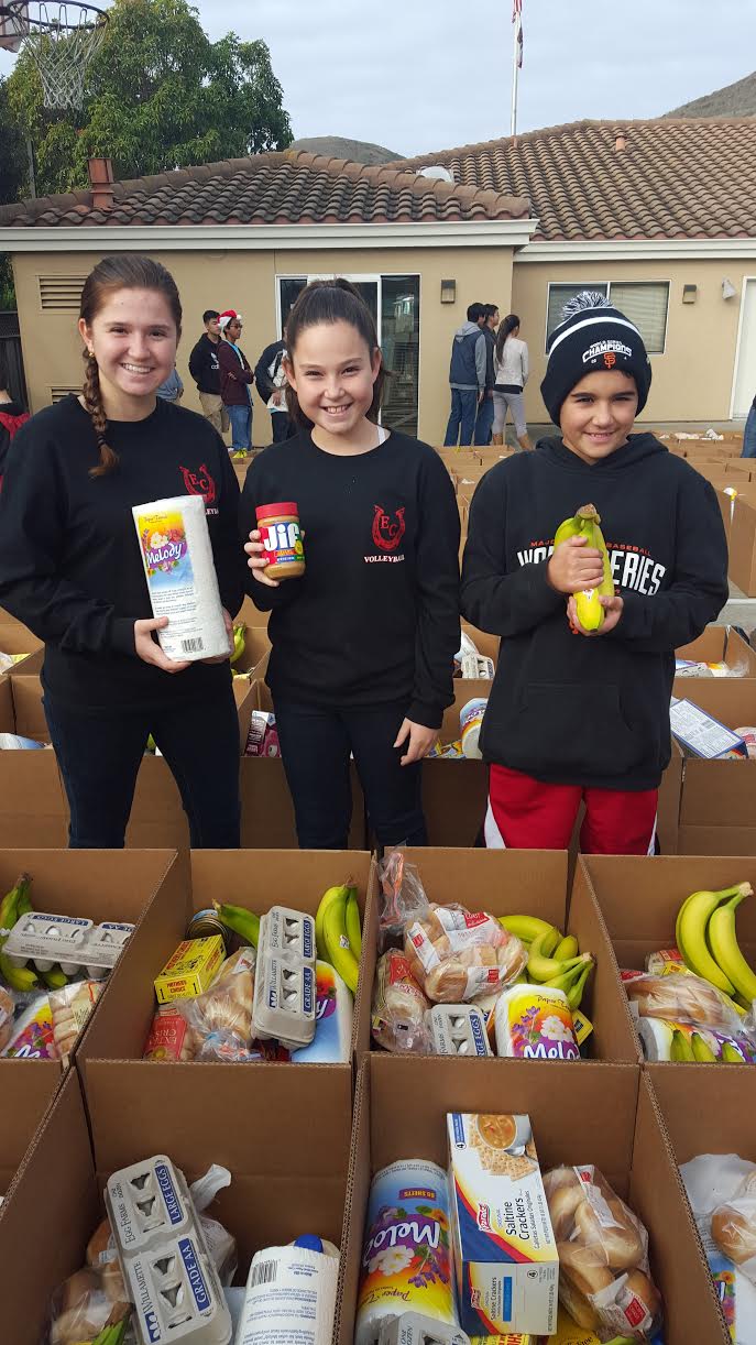 Young volunteers help pack holiday food boxes for the annual Louis P. Guaraldi Food Basket Program in December 2015 at SSF Fire Station 65. Photo Credit: Lisa DeMattei