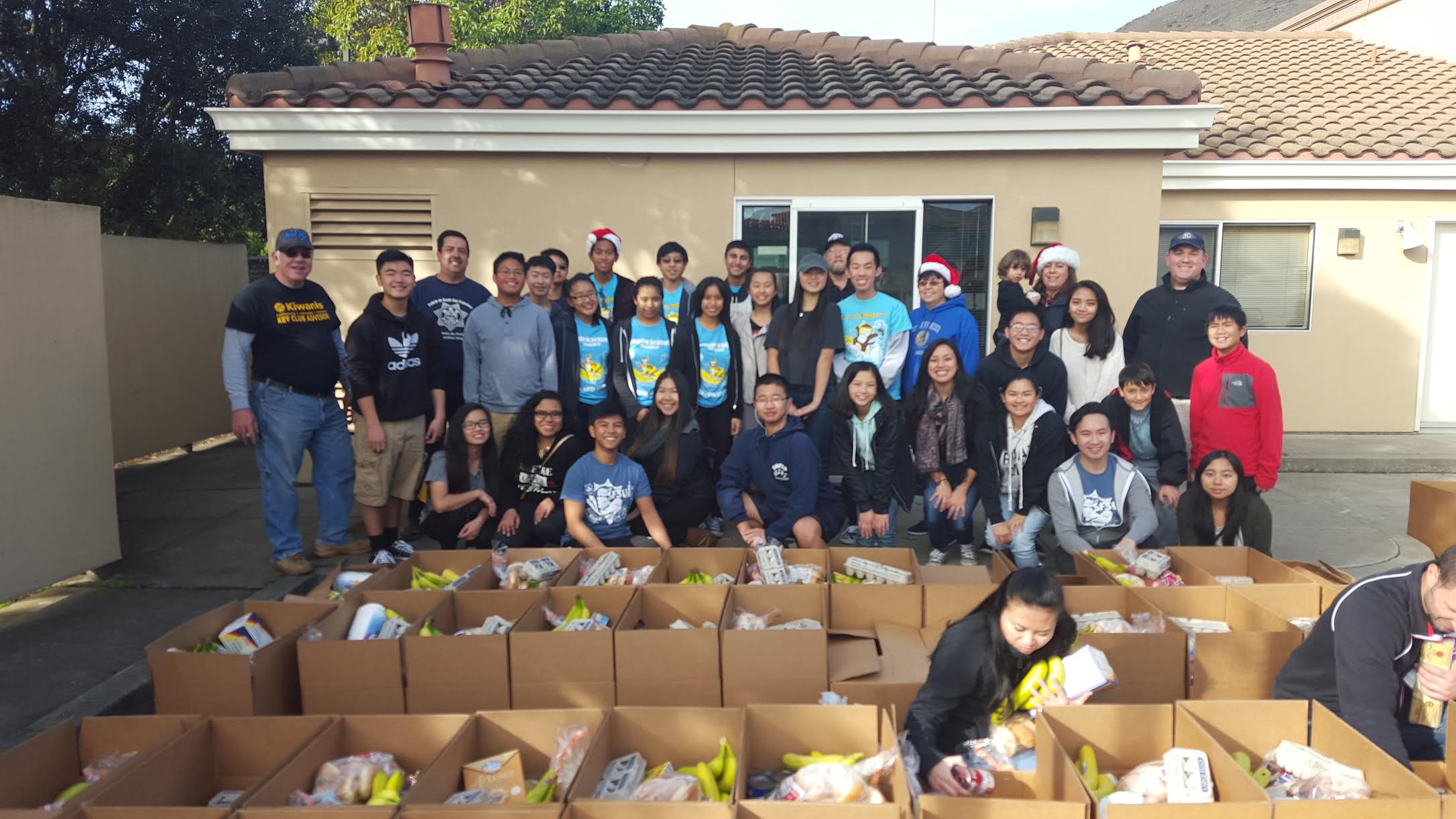 Kiwanis, Key Club, Circle K, and community volunteers helped pack holiday food boxes for the annual Louis P. Guaraldi Food Basket Program in December 2015 at SSF Fire Station 65. Photo Credit: Lisa DeMattei