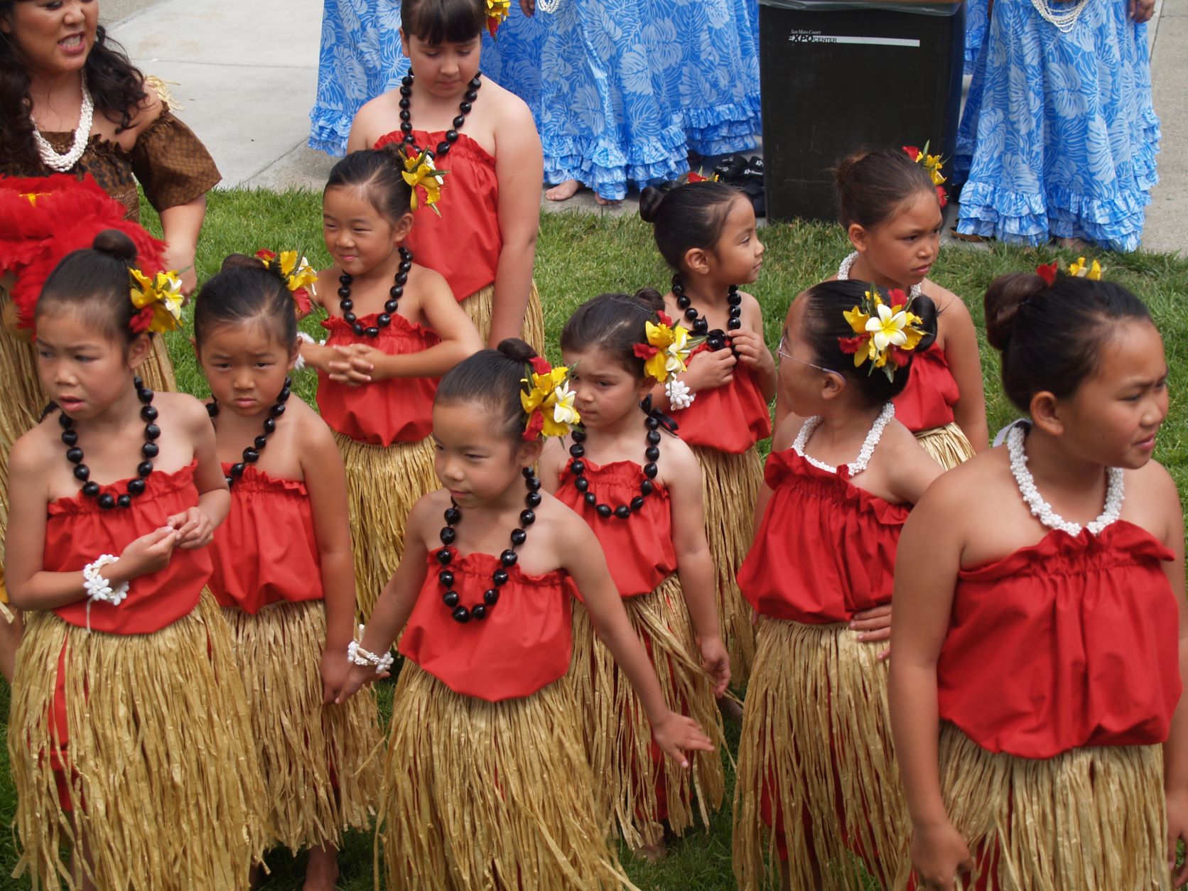 Little girls wearing a Hawaiian outfit