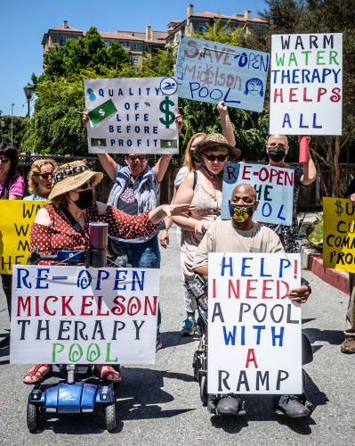 Men and women holding placards