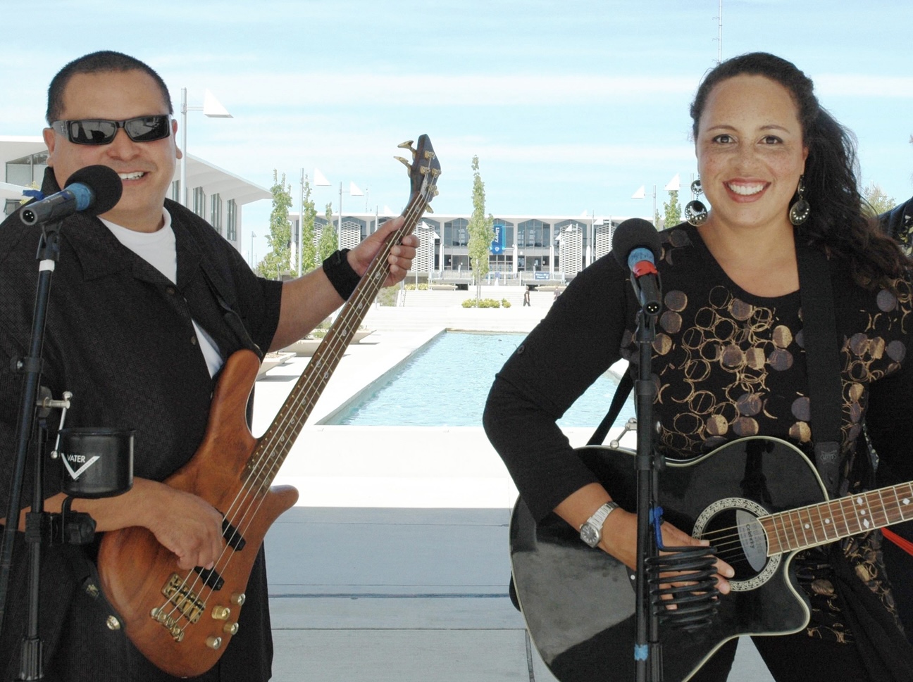 Two people carrying guitars