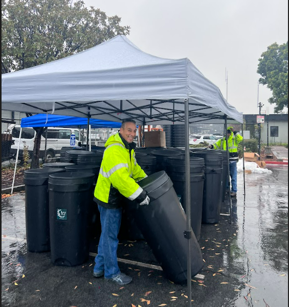 Redwood City Public Works staff prepare rain barrels for distribution. 